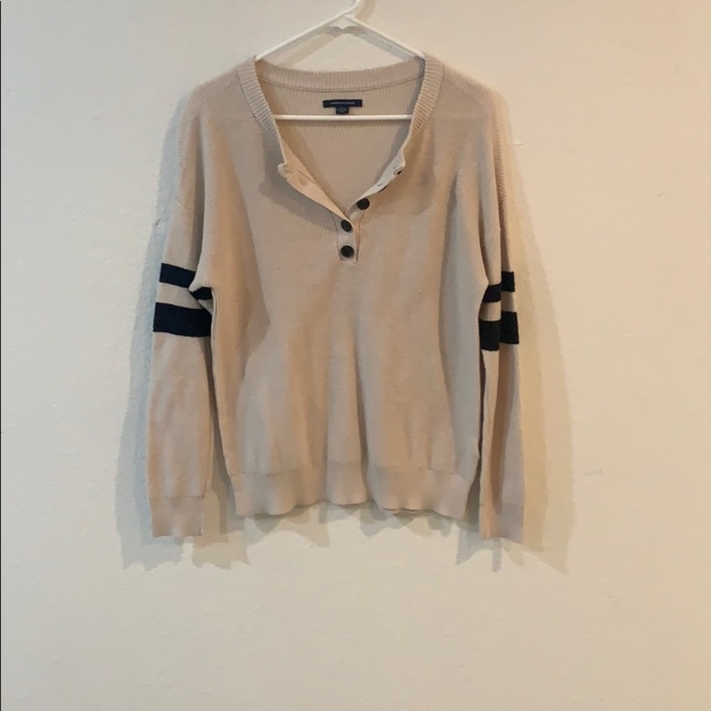 tan and black sweater